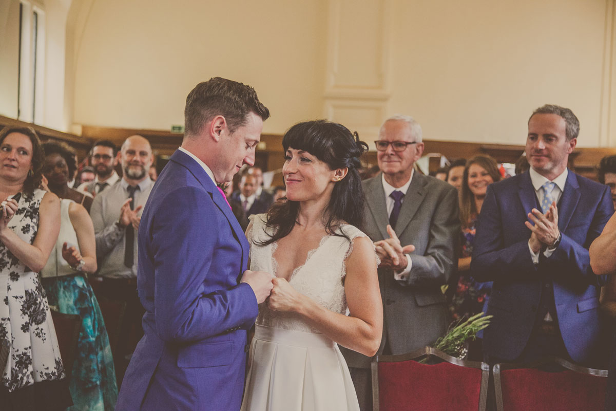 Reportage wedding photographer south london, dulwich college wedding, bride and groom fist bumping London wedding, london wedding photographer